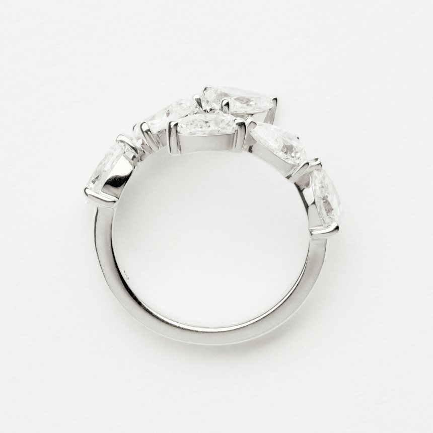 White gold diamond ring on plain background