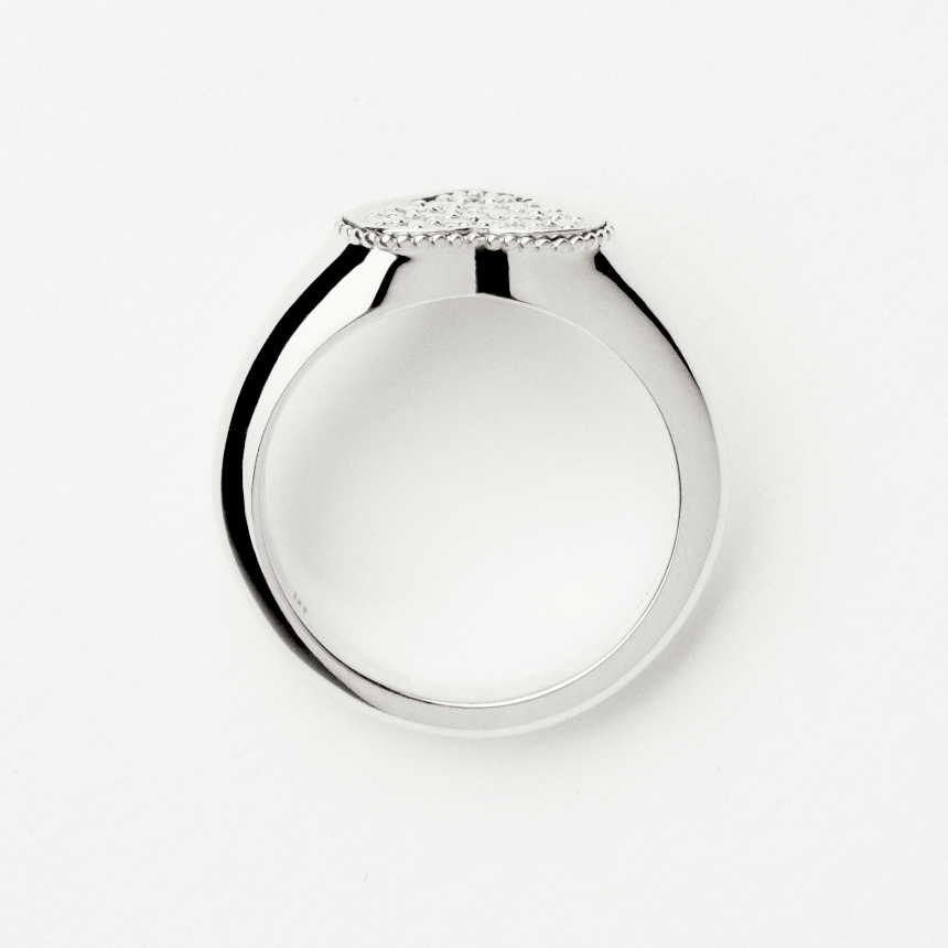 White gold ring with a diamonds on a white background