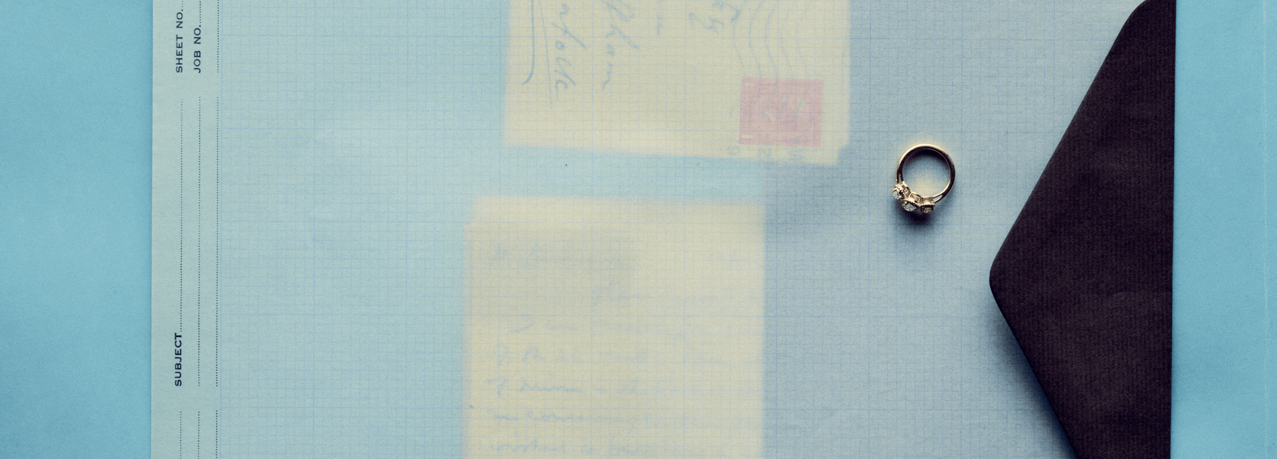Ring on a piece of paper with a blue background